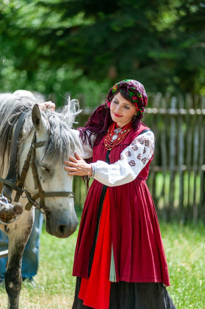 a-woman-in-a-red-dress-petting-a-horse-omt5atzfpfq a-woman-in-a-red-dress-petting-a-horse-omt5atzfpfq